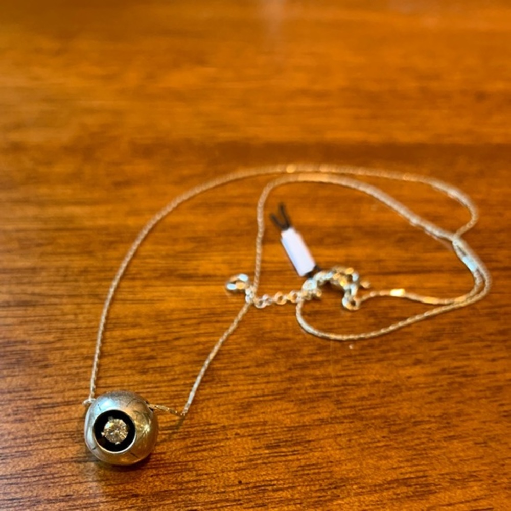 New silver necklace with a ball charm